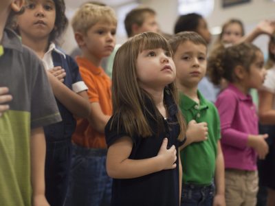 Children reciting Pledge of Allegiance in school
